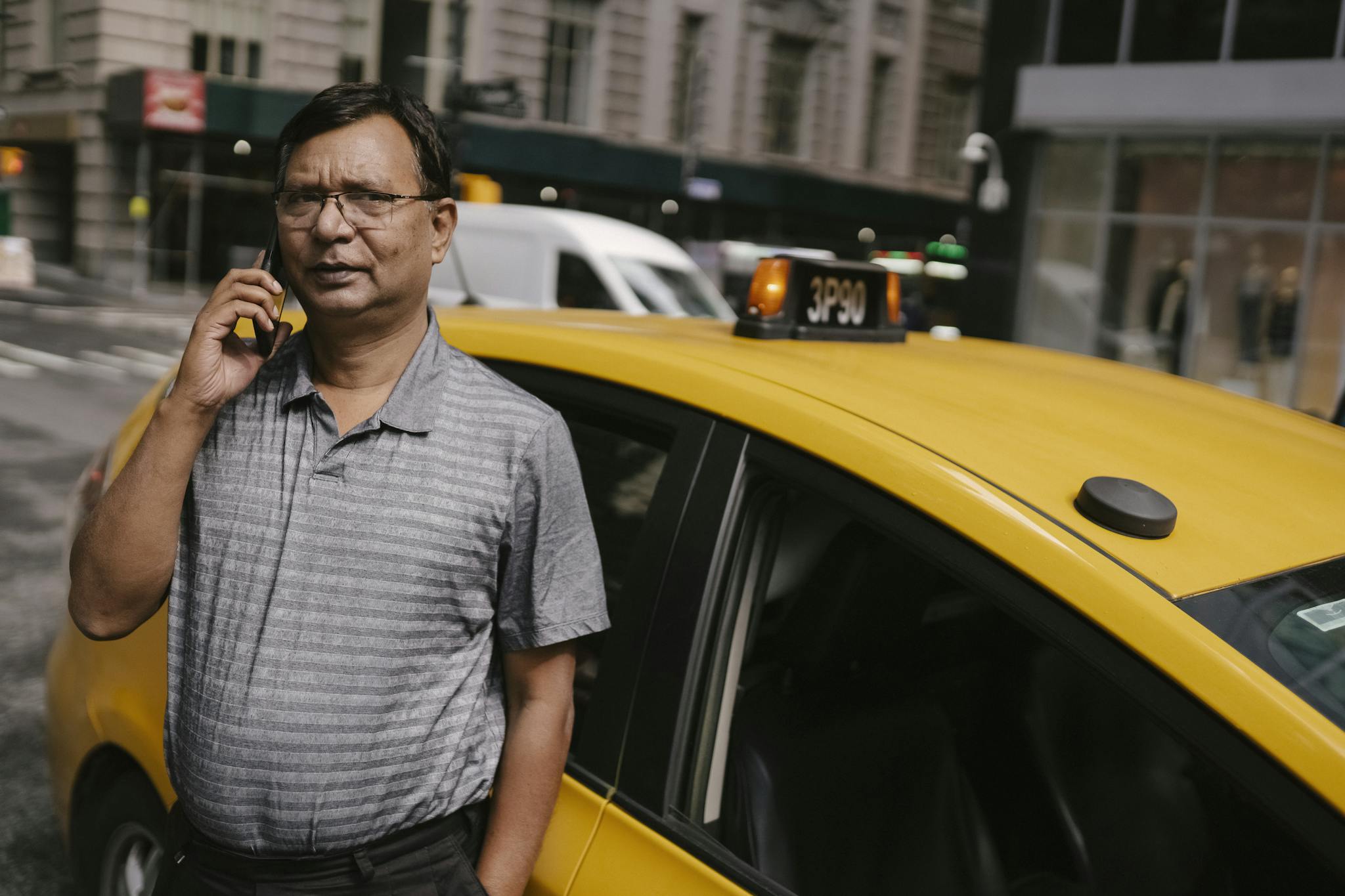 Thoughtful ethnic man talking on phone